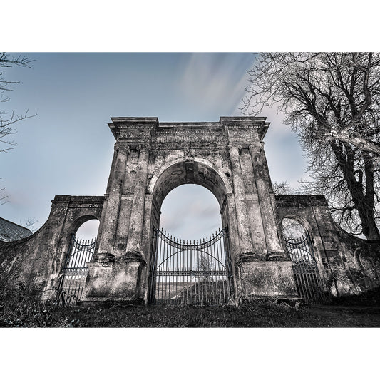 In image number 2671, titled "Freemantle Gate, Godshill" by Available Light Photography, a monochrome photograph showcases an aged stone arch with iron gates, surrounded by trees under a clear sky.