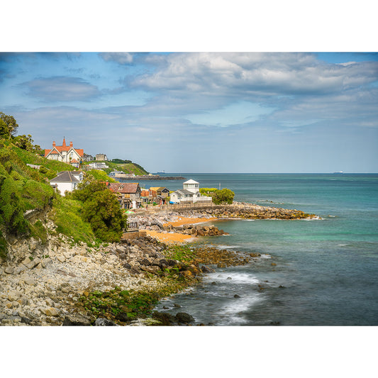 Image number 2630 showcases a coastal village with houses near the shore, featuring rocky terrain and a blue ocean under a partly cloudy sky as seen in Steephill Cove by Available Light Photography.