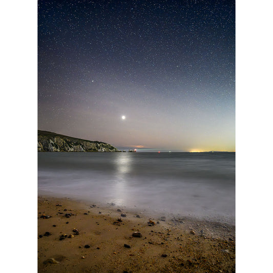 Image number 2659, titled "Venus over The Needles" by Available Light Photography, captures the starry night sky over a calm ocean and sandy beach, with distant cliffs framing the glowing horizon.