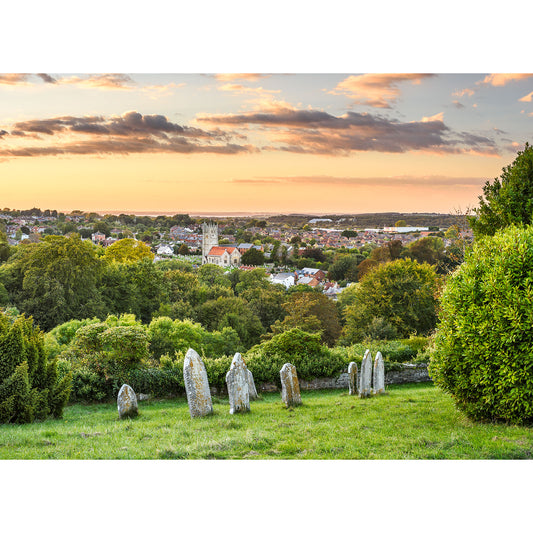 A scenic view of Carisbrooke from Mount Joy on the Isle of Wight with a town and a sunset in the background, captured by Available Light Photography.