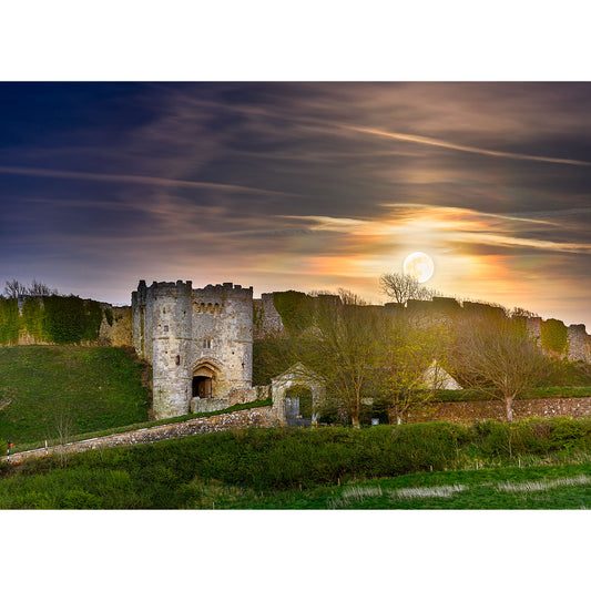 Moonrise over Carisbrooke Castle ruins on the Isle of Wight with vibrant skies and a visible moon captured by Available Light Photography.