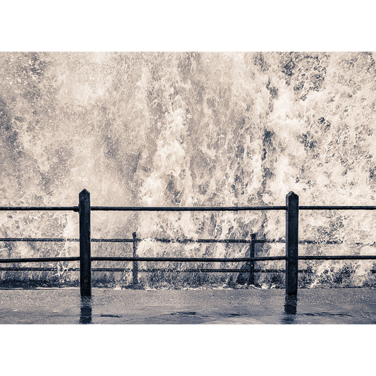 High-contrast image of The Storm crashing against a seaside barrier on the Isle of Wight by Available Light Photography.