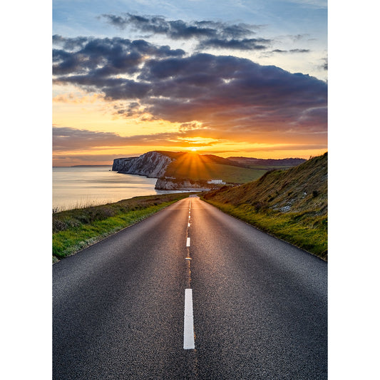 Sunset over Tennyson Down on the Isle of Wight with a view of a cliff beside the ocean, captured by Available Light Photography.